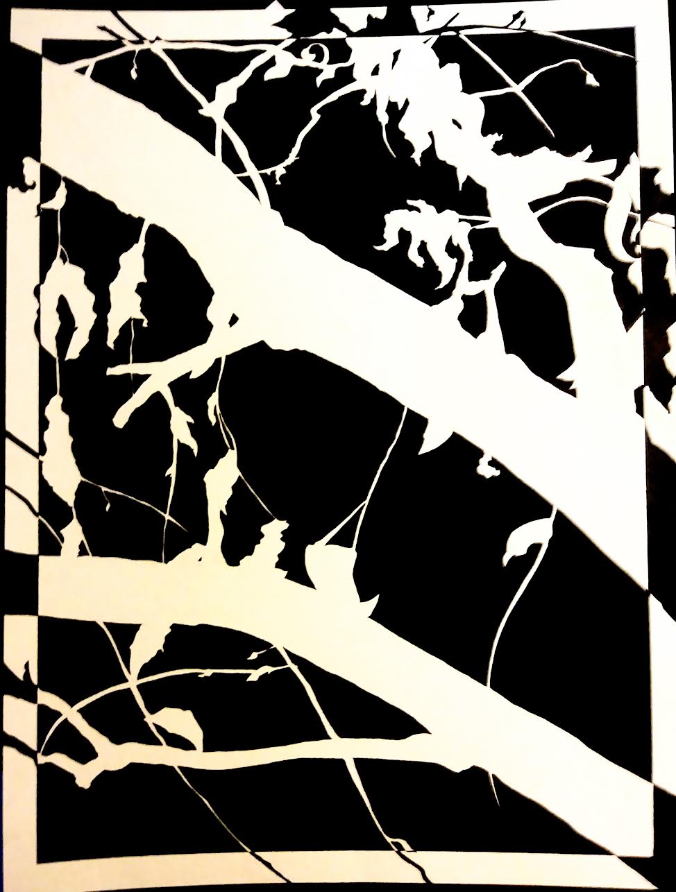 An abstract black and white piece of art that resembles the reverse silhouette (white branches, black background) of a tree.